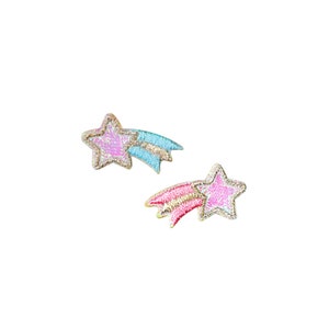 May include: Two pink and gold glitter shooting stars with a blue and gold glitter shooting star.