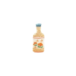 May include: A small embroidered patch of a yellow bottle with a blue top and orange fruit designs.