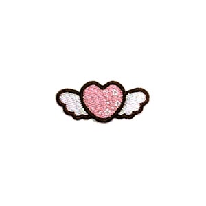 May include: A pink heart with brown outline and white wings. The heart has a white and pink pattern.