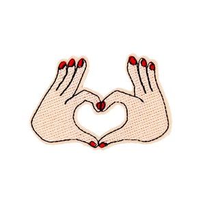 May include: Two hands forming a heart shape with red nail polish.