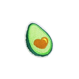 May include: Green embroidered avocado patch with a heart-shaped pit. The avocado is outlined in white.