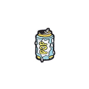 May include: A blue and yellow embroidered iron-on patch of a soda can with the word "POP" in a white speech bubble.