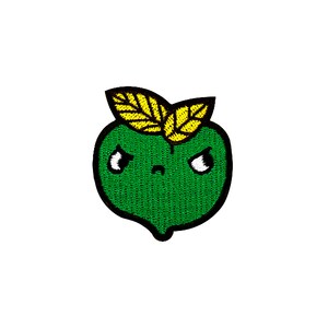 May include: Green embroidered patch of a cartoon apple with a yellow leaf on top. The apple has a frowning face with black eyes and a black mouth.