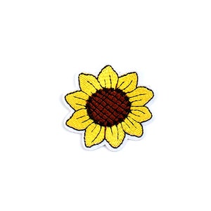Könnte beinhalten: Ein gelber gestickter Sonnenblumen-Patch mit brauner Mitte.
