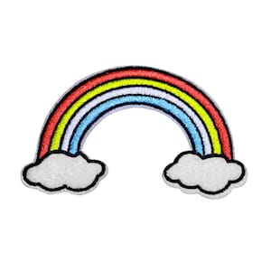 May include: A colorful rainbow with red, orange, yellow, green, blue, and purple stripes. The rainbow is arched over two white fluffy clouds.