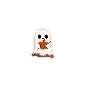 May include: White ghost with a friendly face holding a small orange pumpkin. The ghost is embroidered on a white fabric.
