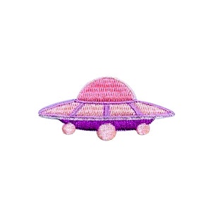 May include: An iron-on patch embroidered with a pink and purple UFO, or flying saucer, featuring three small round windows.