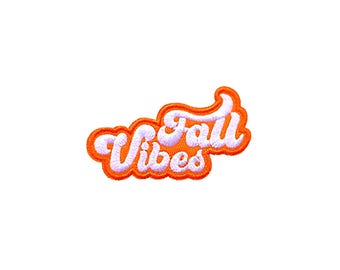 May include: Orange and white embroidered patch with the text "Fall Vibes" in a retro font.