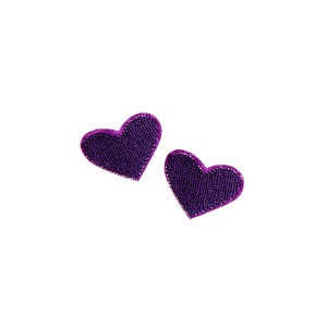 May include: Two purple felt heart-shaped earrings.