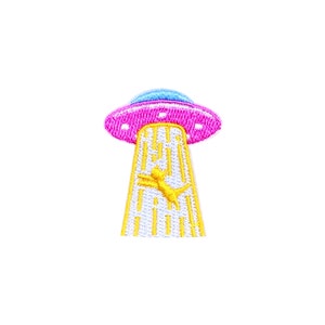 May include: A pink and blue UFO with a yellow cat being beamed up. The UFO has a white and yellow striped beam of light.