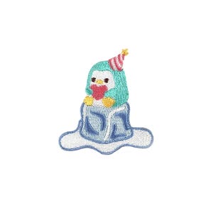 May include: Embroidered iron-on patch featuring a blue penguin wearing a red and white party hat, holding a red heart, and sitting on a blue iceberg.