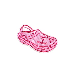 May include: Pink embroidered patch of a single clog shoe.