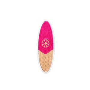 May include: Pink and beige embroidered surfboard patch with a white outline.