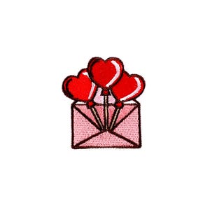 May include: An embroidered patch with a pink envelope and three red heart-shaped balloons coming out of the top.