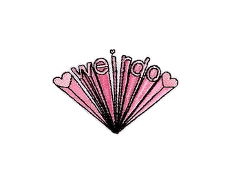 May include: Pink embroidered patch with the text "weirdo" in a stylized font with two hearts on either side of the text.