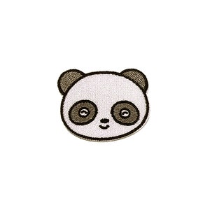 May include: A black and white panda bear face with brown ears and eyes. The panda is smiling.