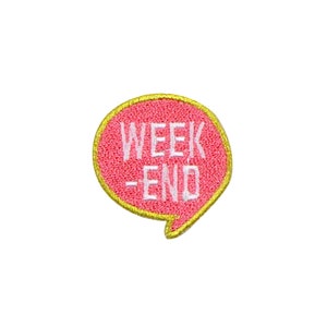 May include: Pink and gold embroidered iron-on patch with the text "WEEK-END" in a speech bubble shape.