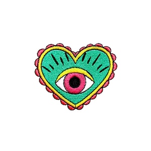 May include: Embroidered heart-shaped patch with a teal center featuring an eye design. The eye has a pink iris and a yellow outline. The patch is bordered by a scalloped red trim and a yellow outline.