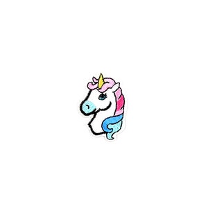 May include: A white unicorn head with a pink and blue mane and a yellow horn. The unicorn is looking to the left.