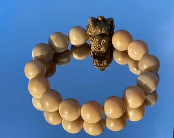 Natural bodi root with a green sandalwood carved dragon bead bracelet 天然菩提根配绿檀木龙头雕刻手串