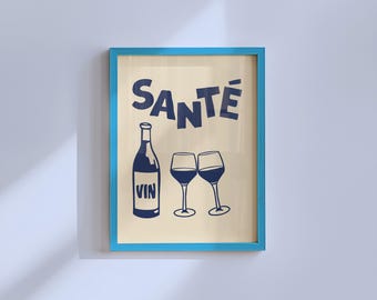 May include: A framed print with a light blue frame. The artwork features a dark blue illustration of a wine bottle, two wine glasses, and the word "SANTÉ" above. The word "VIN" is printed on the wine bottle.