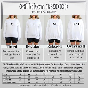 May include: Size chart for Gildan 18000 crewneck sweatshirts. The chart shows the width, length, and sleeve length in inches for sizes S through 5XL. The chart also includes descriptions of the fit for each size: fitted, regular, relaxed, and oversized.