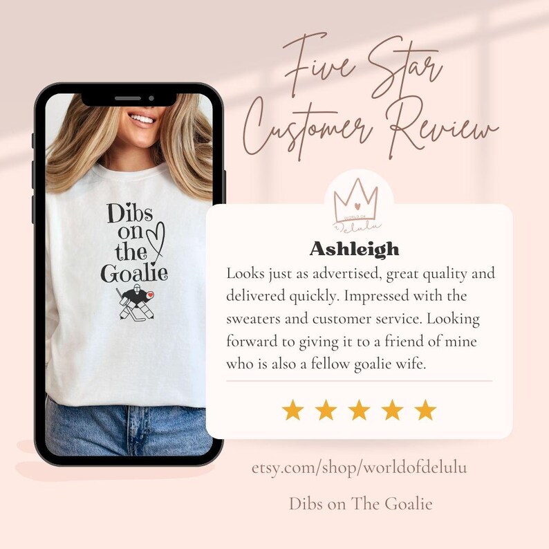 May include: A white sweatshirt with a black graphic of a hockey goalie and the text "Dibs on the Goalie". The sweatshirt is shown on a model and has a five-star customer review with the text "Looks just as advertised, great quality and delivered quickly. Impressed with the sweaters and customer service. Looking forward to giving it to a friend of mine who is also a fellow goalie wife."