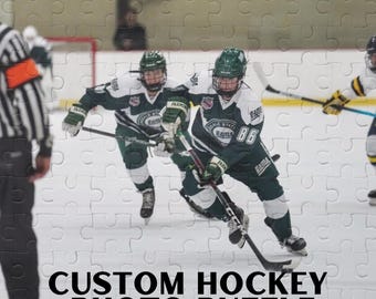 May include: A custom hockey photo puzzle featuring three hockey players in green and white uniforms with the text "Fall State Rama" on their jerseys. The players are on a white ice rink with a referee standing to the left of the image.