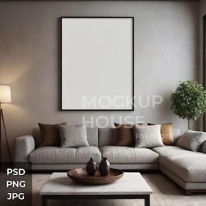 May include: A grey sectional sofa with brown throw cushions in a living room featuring a large framed picture on the wall, a floor lamp, and a potted plant. The sofa is positioned in front of a large window with a view of trees.
