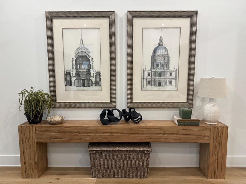 Handmade rustic wood console table with a thick plank top, chunky square legs, natural wood grain, and a warm brown finish.