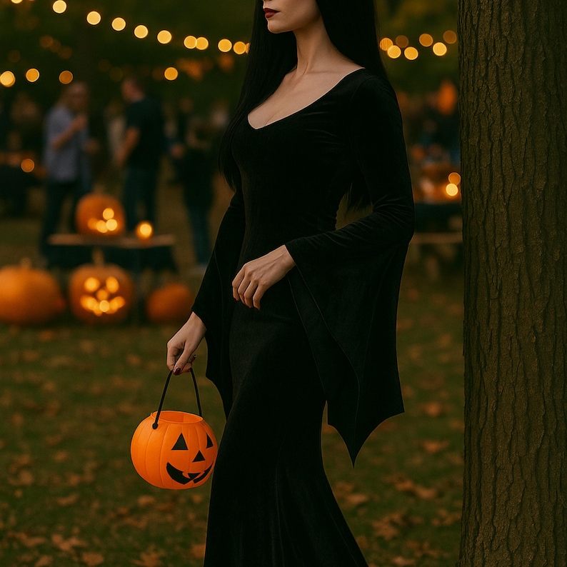May include: A woman in a long black velvet dress with flared sleeves holds an orange jack-o'-lantern bucket. The background features carved pumpkins and string lights, creating a Halloween atmosphere.