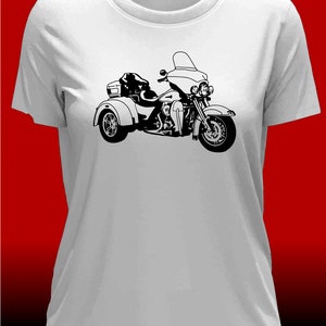 May include: A white t-shirt featuring a black silhouette of a three-wheeled motorcycle.