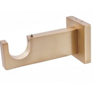 May include: A gold-colored curtain rod bracket. The bracket has a rectangular base with two screw holes, a straight arm, and a curved end to hold a curtain rod. The metal fixture is designed to be mounted on a wall.