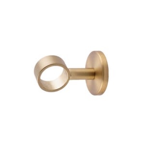 May include: A gold-colored curtain rod bracket. The bracket has a circular ring to hold the rod, a short connecting arm, and a round base for mounting. The finish is a matte gold, and the design is simple and modern.