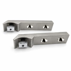 May include: Two identical brushed metal brackets with a rectangular profile. Each piece features two countersunk screw holes along the flat side and a protruding square block with a threaded hole at the curved end for secure mounting hardware.