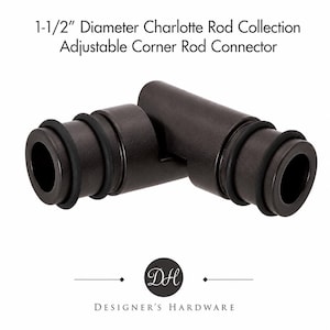 May include: A dark bronze adjustable corner rod connector from the Charlotte Rod Collection with a 1-1/2 inch diameter. The hardware features two cylindrical ends with black rubber rings and a central pivoting joint for angled curtain rod installation.