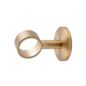 May include: A gold metal curtain rod bracket with a round opening for the rod to fit through. The bracket is designed to be mounted to a wall or ceiling.