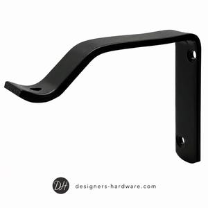 May include: A matte black metal curtain rod bracket featuring an L-shaped design with a curved support arm and two circular mounting holes on the vertical plate. The text designers-hardware.com is printed at the bottom of the image.