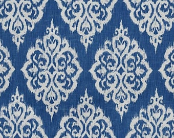 May include: A blue and white patterned fabric featuring a repeating damask design. The pattern is a classic, ornate style with a textured appearance. The background is a deep blue, and the design is white. This fabric is suitable for upholstery, drapery, or other home decor projects.