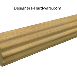 May include: A close-up of a natural wood molding with a fluted design. The molding is approximately 1 inch wide and has a smooth, unfinished surface.