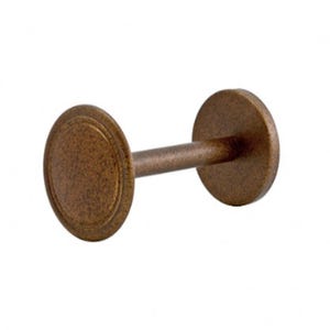 May include: Bronze-colored curtain tieback with a decorative, textured design. The tieback features two circular end pieces connected by a cylindrical bar. The circular ends have a raised, concentric ring pattern.