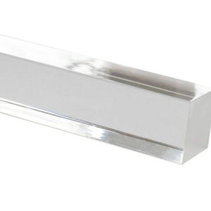 May include: A clear acrylic rod with a square cross-section. The rod is smooth and polished.