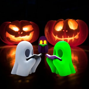 Libro de lectura de fantasmas de Halloween con vela de té LED