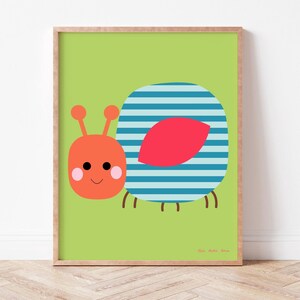May include: A framed art print featuring a cartoon illustration of a friendly-looking snail. The snail has an orange head with antennae, a blue and white striped shell, and a red leaf-shaped detail. The background is a solid light green.