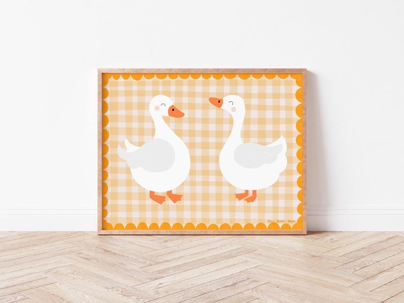 May include: A printable art print featuring two white geese with orange beaks and feet on a yellow and white gingham background.