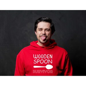 Wooden Spoon Survivor - Unisex Hoodie (White Font)