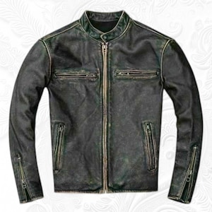 May include: A distressed black leather jacket with a stand-up collar and a full-length zipper. The jacket features two zippered chest pockets, two lower zippered pockets, and zippered cuffs. The leather has a worn, vintage appearance.