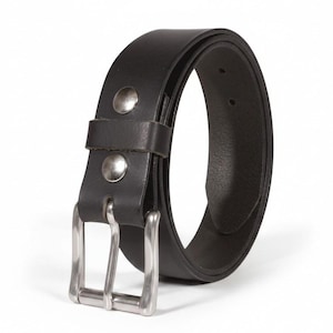 May include: A black leather belt with a silver-colored buckle and two silver rivets. The belt is curved, showing its thickness and the details of the buckle design. The belt is a classic accessory.