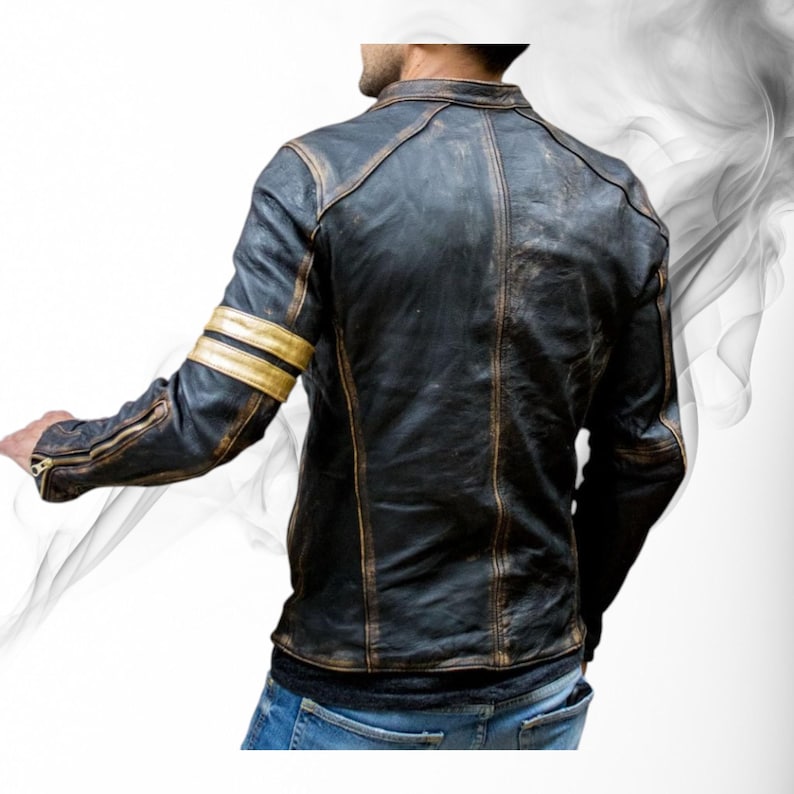 May include: Black leather jacket with gold stripes on the left sleeve. The jacket has a distressed, vintage look with visible wear and tear. Features include a zipper on the sleeve and a classic collar.