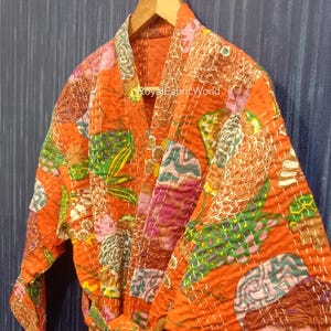 May include: A white ceramic mug with a black handle and the text "But First, Coffee" in a black, handwritten-style font. The mug is on a white surface.